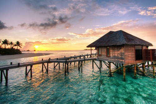 Image brown wooden dock on sea under blue sky during sunset