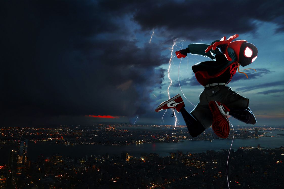 man in black and red jacket and black pants doing stunts on top of building during