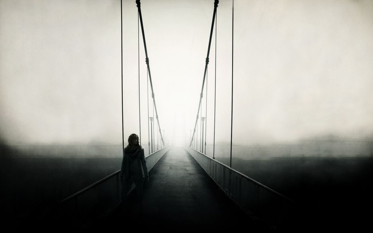 man and woman walking on bridge