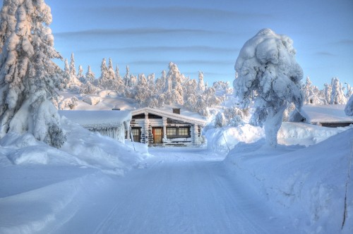 Image brown house on snow covered ground during daytime