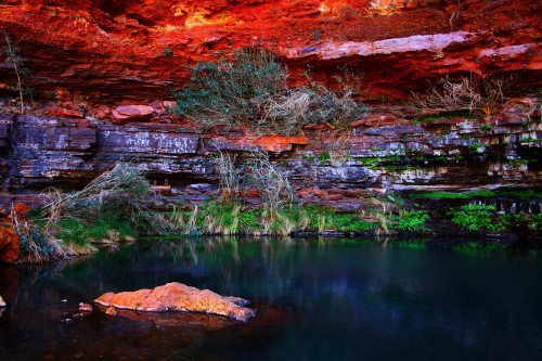 Image brown rock formation beside body of water during daytime