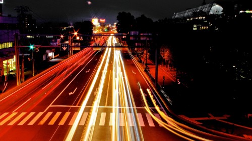 Image time lapse photography of cars on road during night time