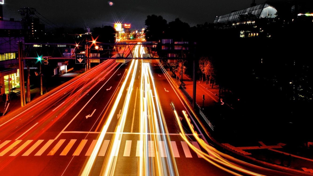 time lapse photography of cars on road during night time