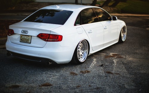 Image white sedan on gray concrete road