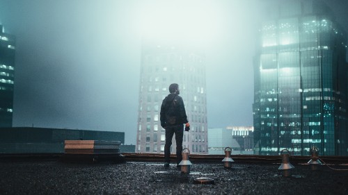 Image man in black coat standing on the ground