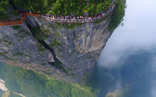 Image people walking on bridge over the river