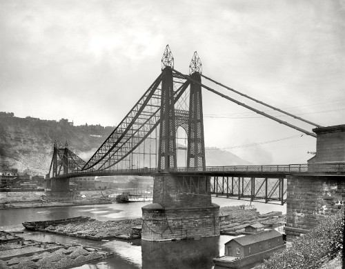 Image grayscale photo of bridge over river