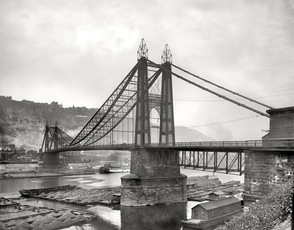 grayscale photo of bridge over river