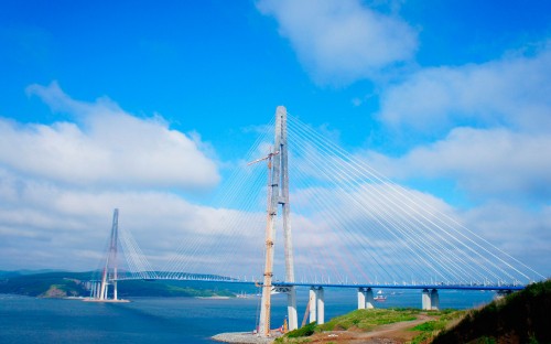 Image white bridge under blue sky during daytime