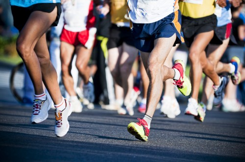 Image people running on the street during daytime