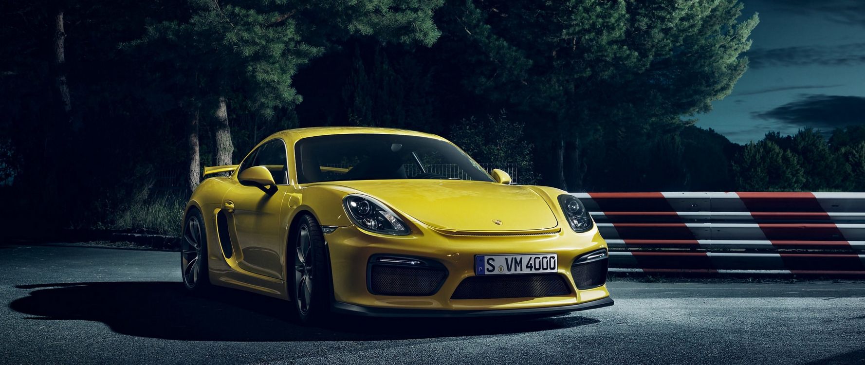 yellow porsche 911 parked on road during daytime