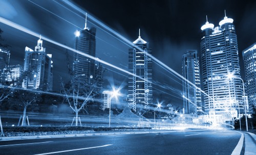 Image city buildings with lights turned on during night time