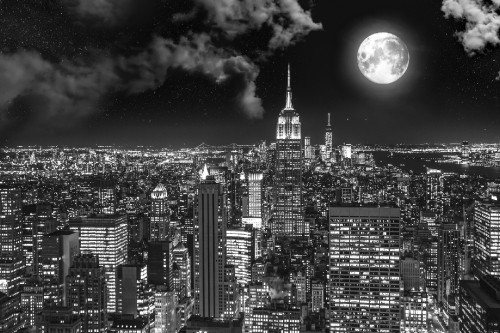 Image grayscale photo of city buildings during night time