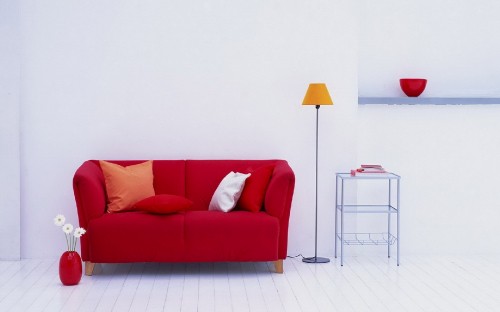 Image red and white sofa with throw pillows