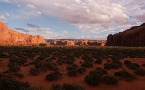 Image brown rock formation under white clouds during daytime