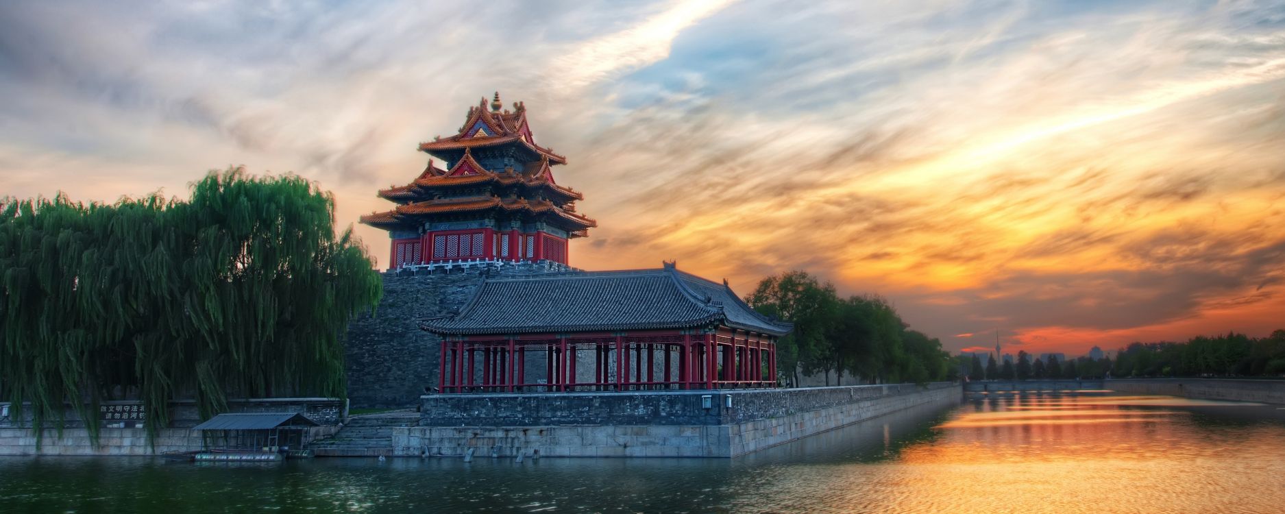 red and white temple near body of water during daytime