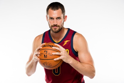 Image man in red and blue tank top holding basketball