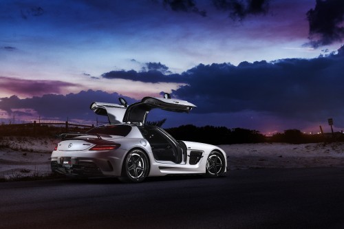 Image white and black porsche 911 on road under blue sky