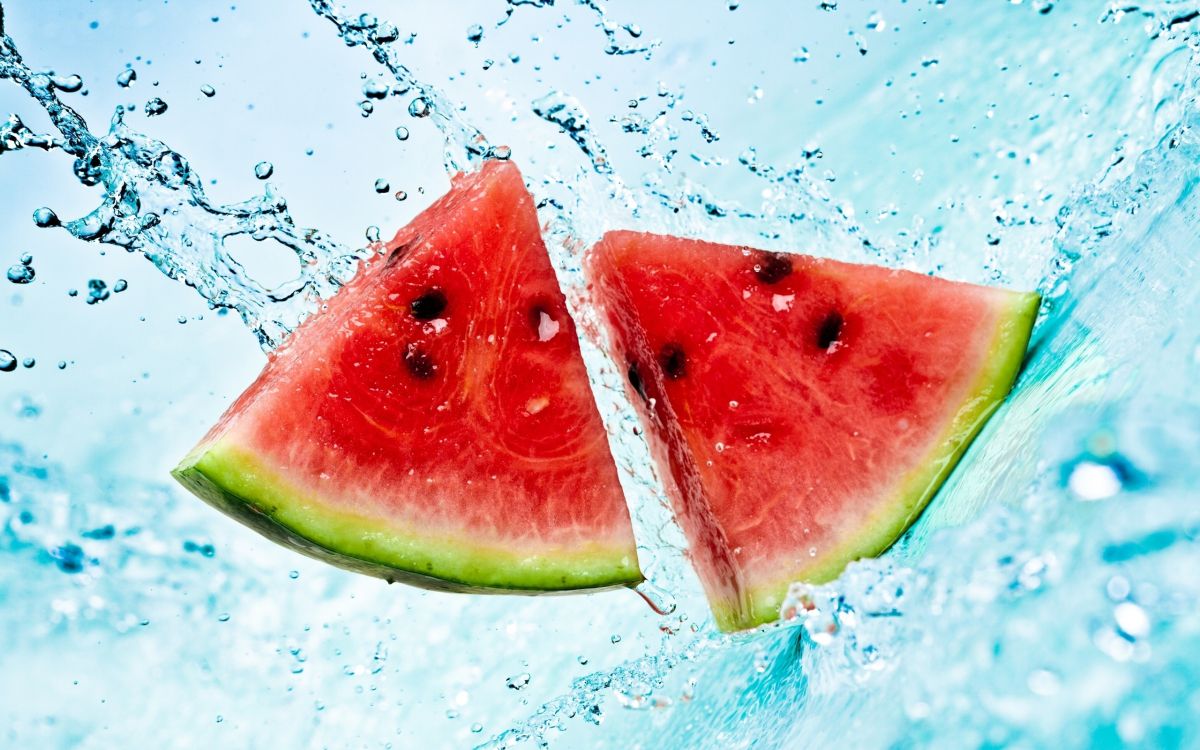 Sliced Watermelon on Water With Water Droplets. Wallpaper in 2560x1600 Resolution