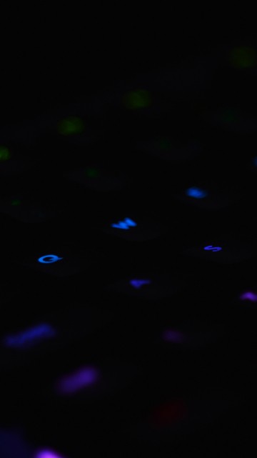 Image purple and pink lighted computer keyboard