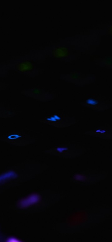 Image purple and pink lighted computer keyboard