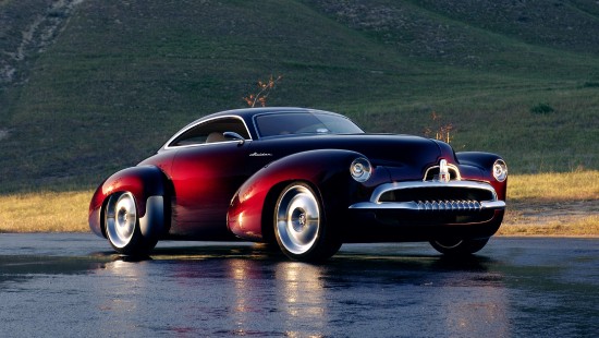 Image red coupe on road during daytime