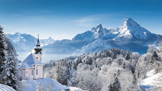 Image white and black house on snow covered mountain during daytime