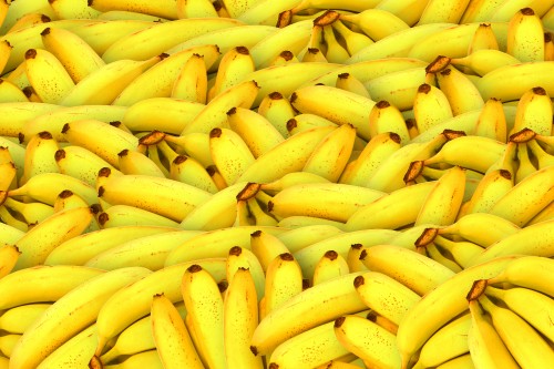 Image yellow banana fruit on brown wooden table