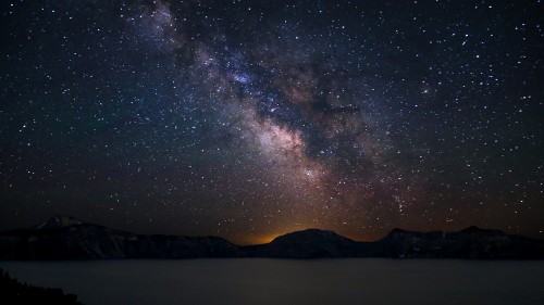 Image silhouette of mountain under starry night