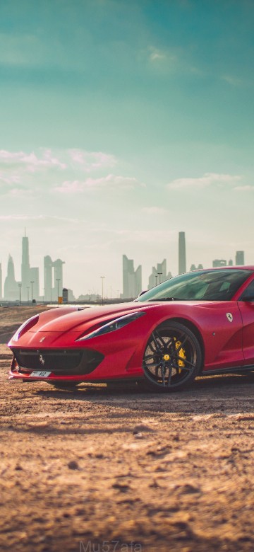 Image red ferrari 458 italia on brown field