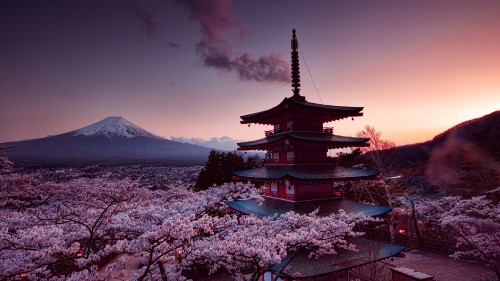 Image black and white temple near mountain under cloudy sky during daytime