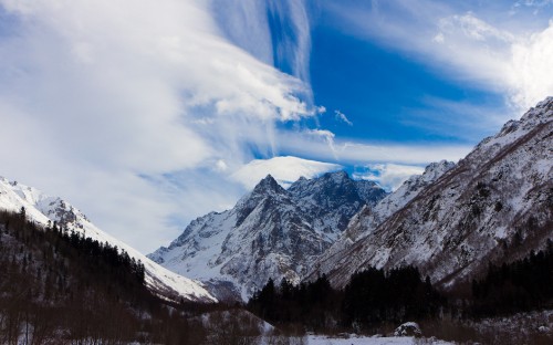 Image snow covered mountain under blue sky during daytime