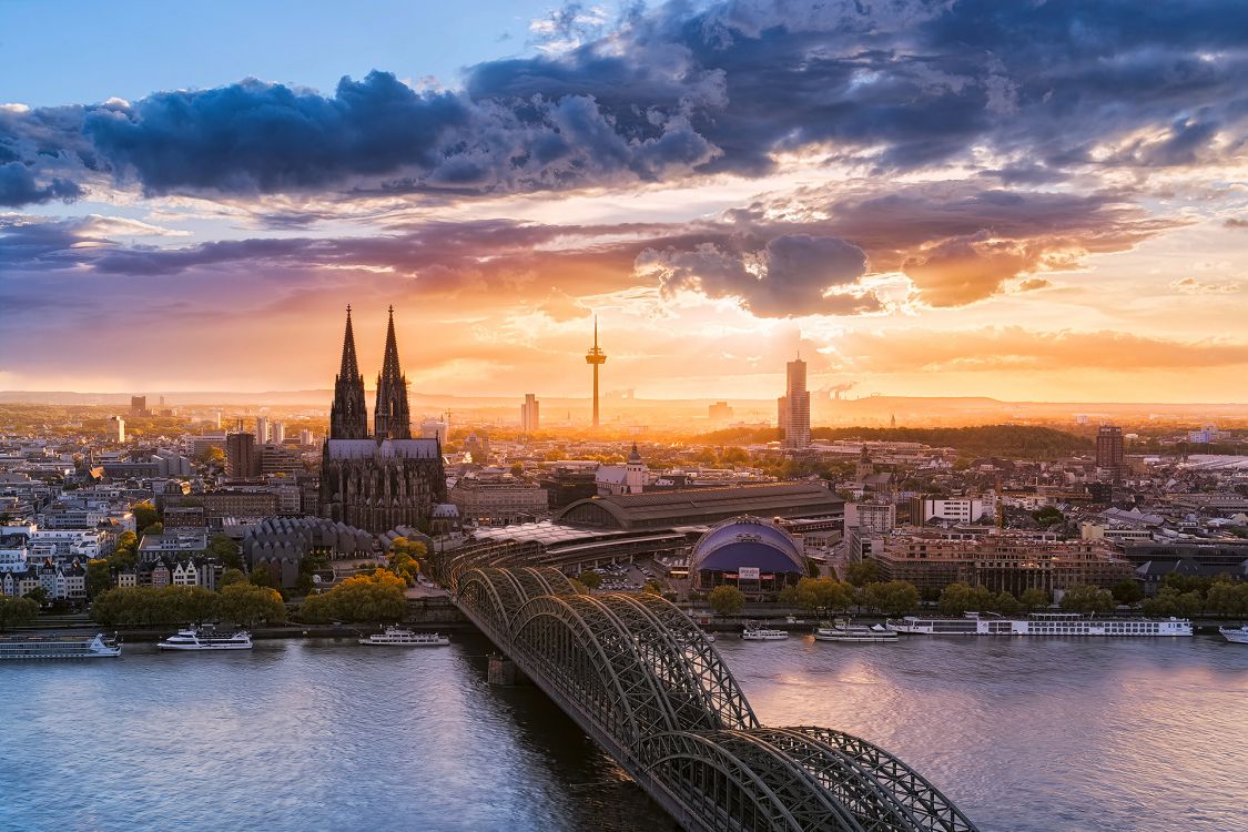 city skyline under blue and white cloudy sky during daytime