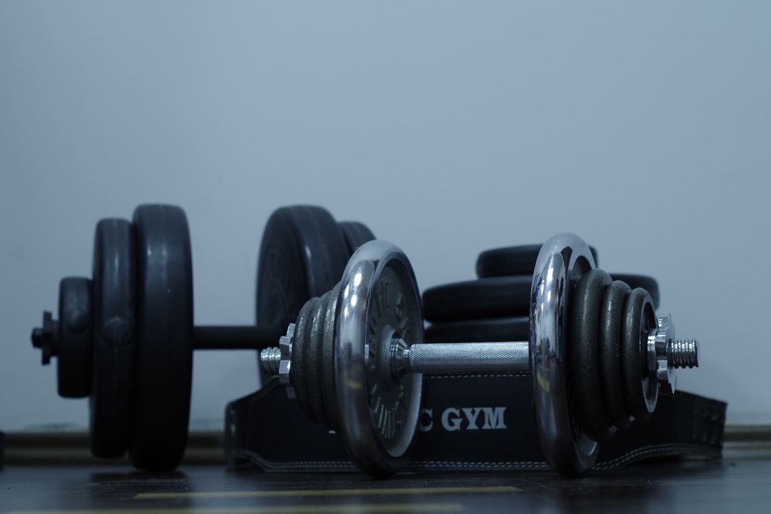 2 Black Dumbbells on Brown Wooden Table. Wallpaper in 5472x3648 Resolution