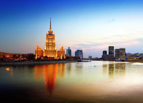 Image city skyline across body of water during daytime