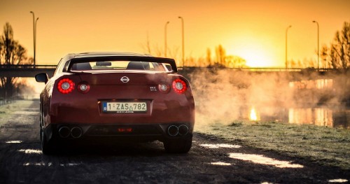 Image red chevrolet camaro on road during sunset