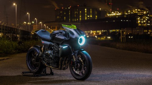 Image green and black sports bike on road during night time