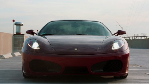 Image red ferrari 458 italia on road during daytime