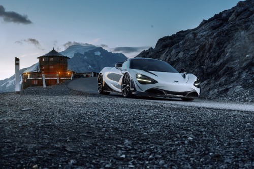 Image white and black sports car on road during daytime