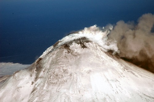 Image white and gray mountain under blue sky during daytime