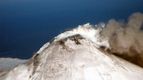 Image white and gray mountain under blue sky during daytime