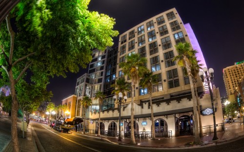 Image cars parked beside building during night time