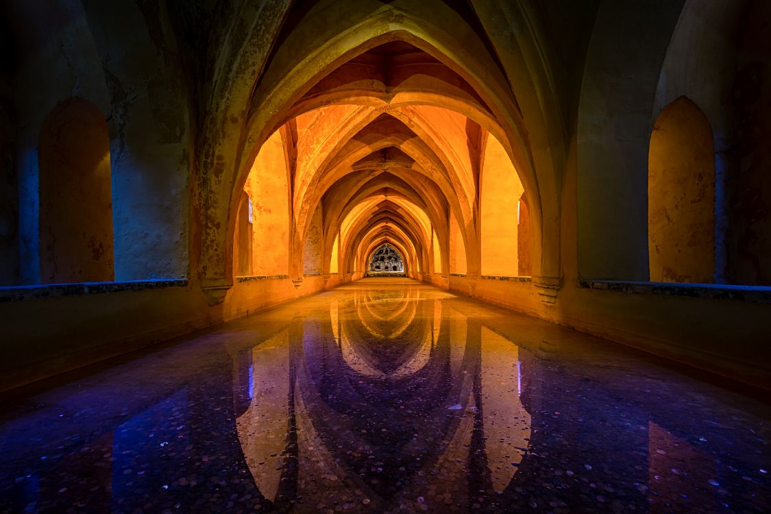 brown concrete tunnel with light