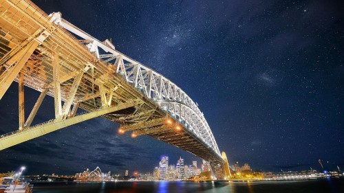 Image gray steel bridge under blue sky during night time