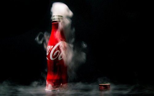 Image coca cola bottle on water