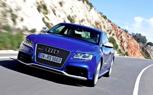 Image blue audi a 4 on road during daytime