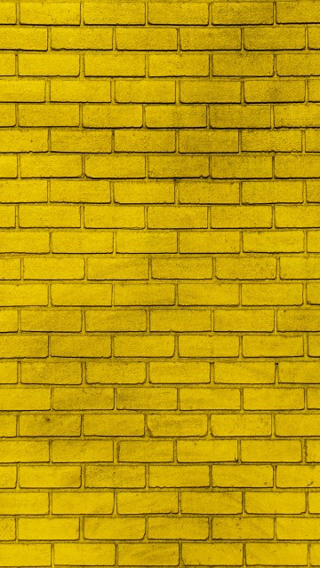 Image yellow and black brick wall