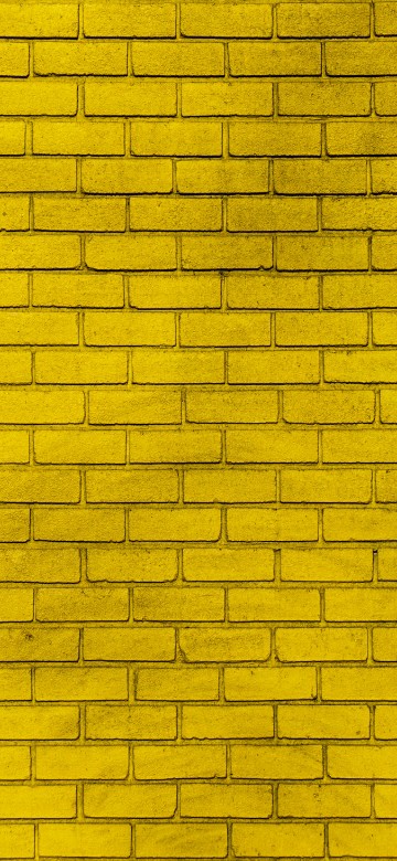 Image yellow and black brick wall