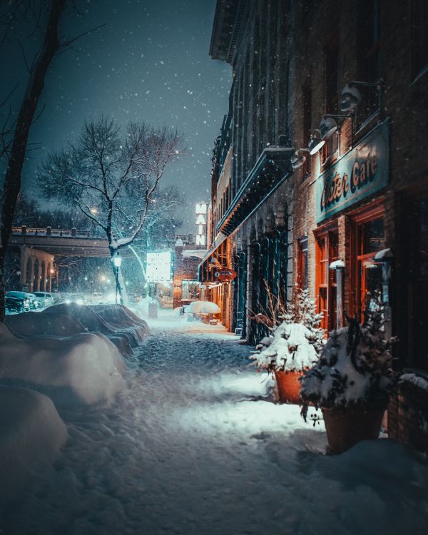 Snow Covered Road Between Buildings During Daytime. Wallpaper in 3290x4112 Resolution