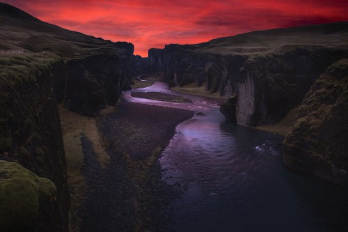 Image body of water between mountain during sunset